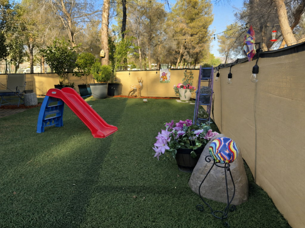make your home special for grandchildren, Soccer ball on a stand in a small fenced yard built for a grandchild