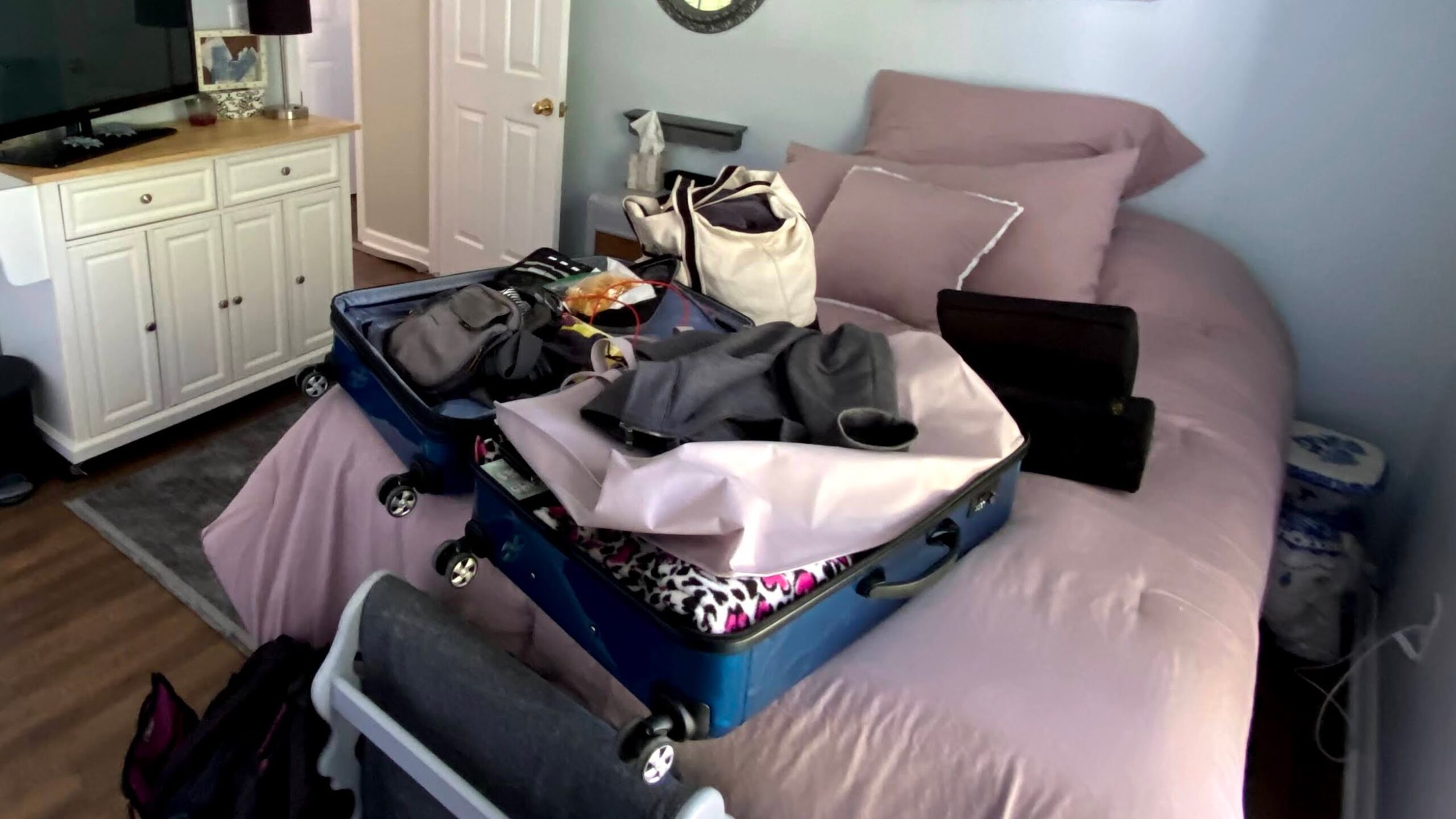 A suitcase packed for a long stay to help after the baby's born