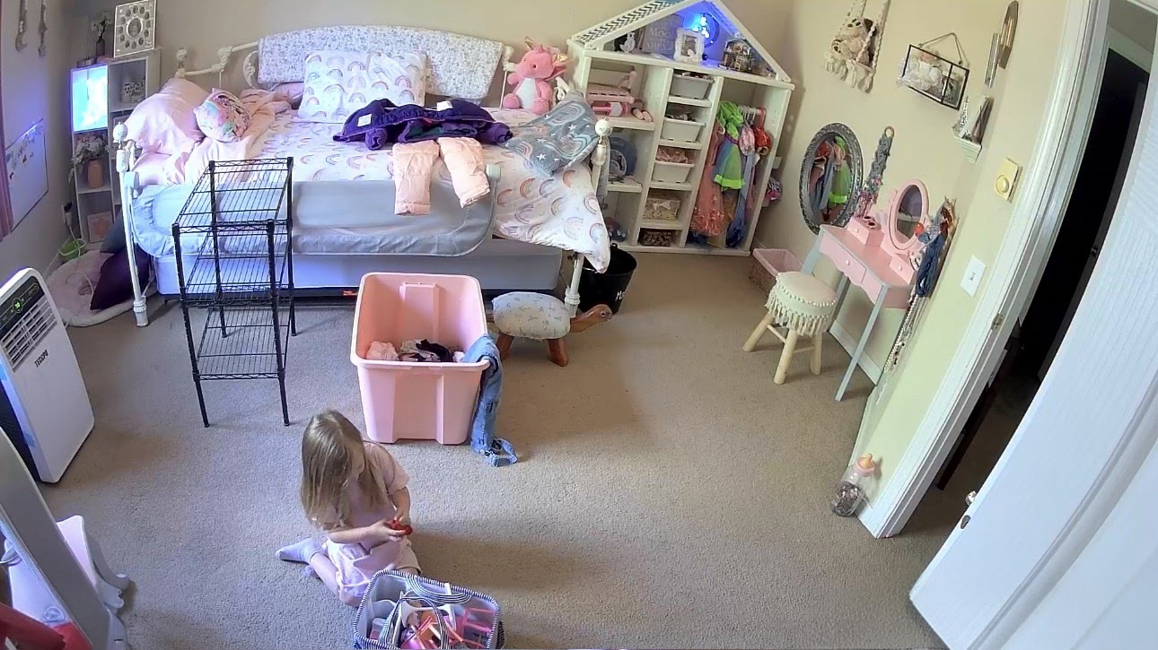 Toddler playing in her new bedroom while her family prepares for a new baby sibling. Preparing a Toddler for a New Sibling