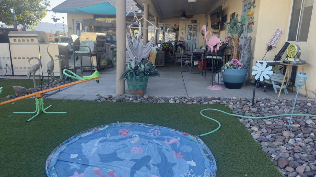 make your home special for grandchildren. Backyard with a pool, teeter-totter, and covered patio at grandmother's house