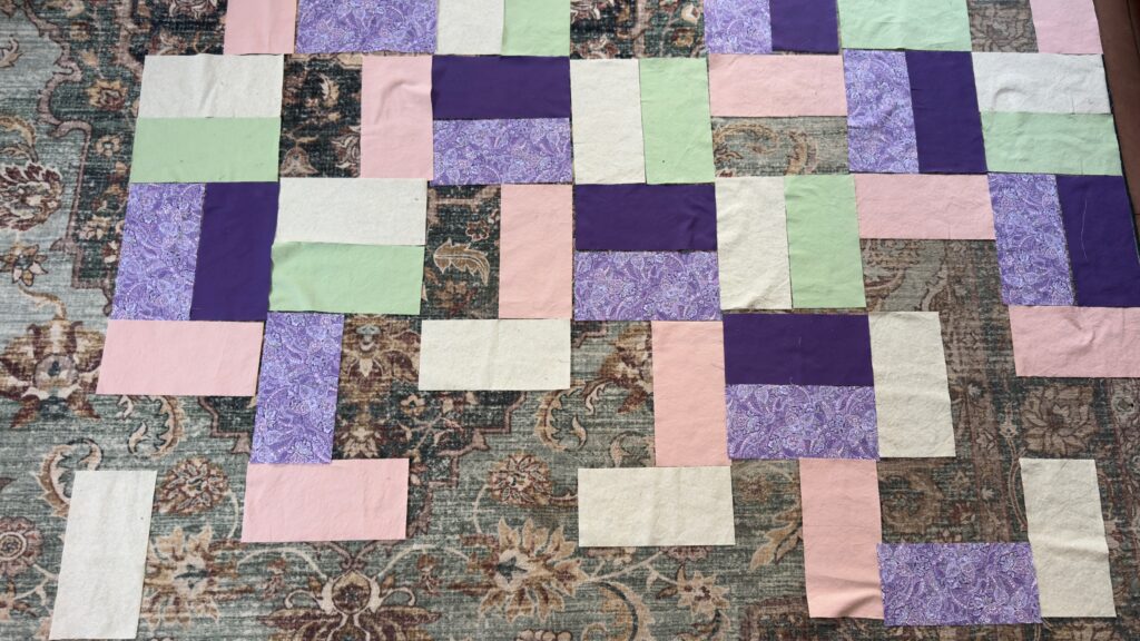 becoming a grandmother later in life. A handmade quilt in progress, made as a keepsake for a grandchild